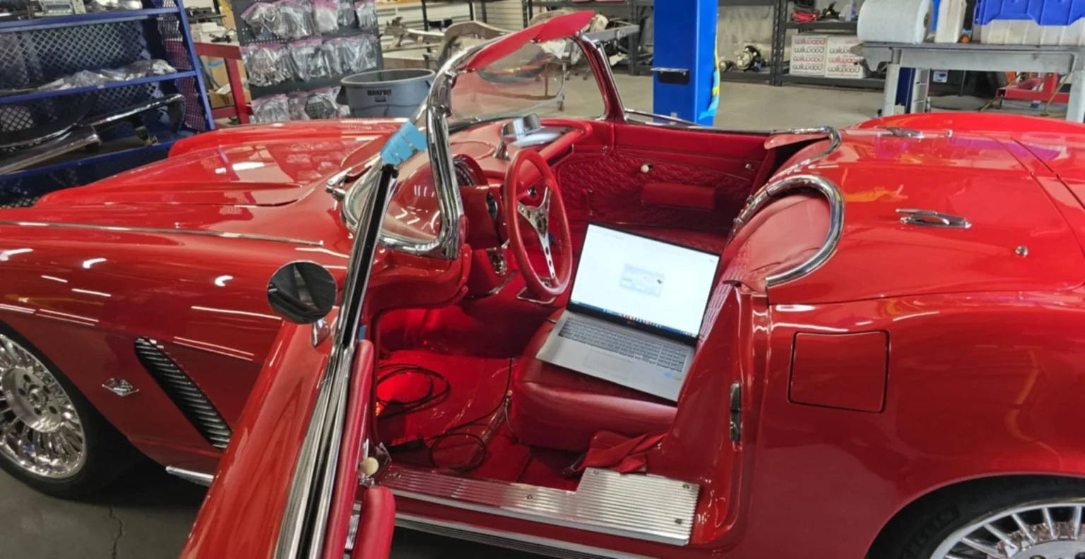 Calibration laptop inside a classic Corvette