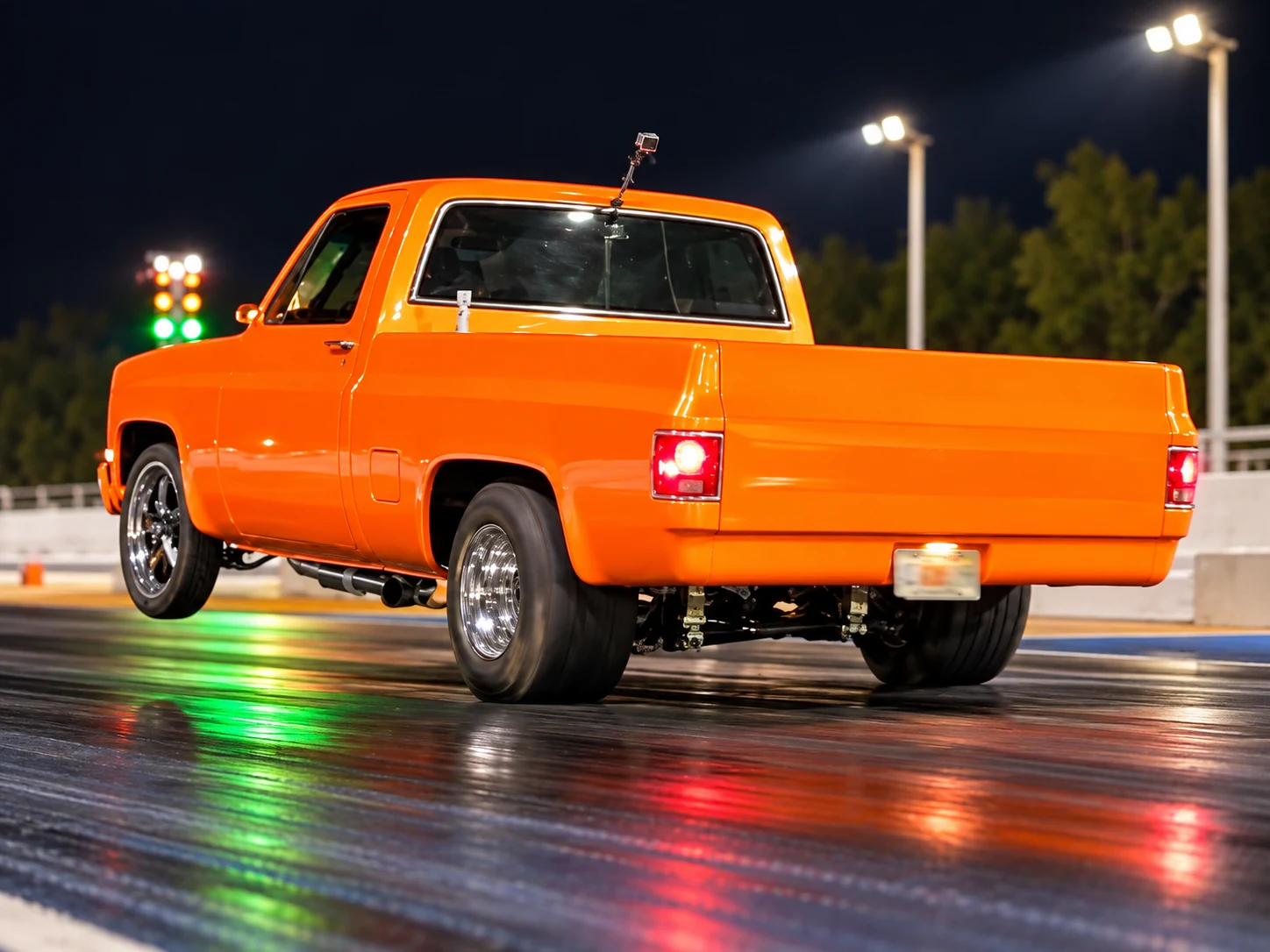 Orange Chevrolet pickup at the drag strip